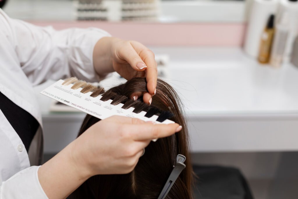 Trichologist using professional analysis tool to check patient's scalp.