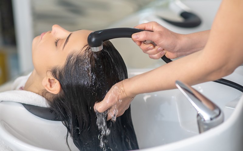 Woman-getting-her-hair-washed-for-healthy-scalp-care