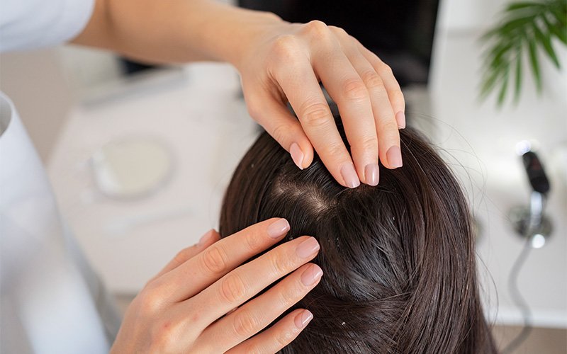 trichologist-examining-scalp-and-hair-of-female-patient