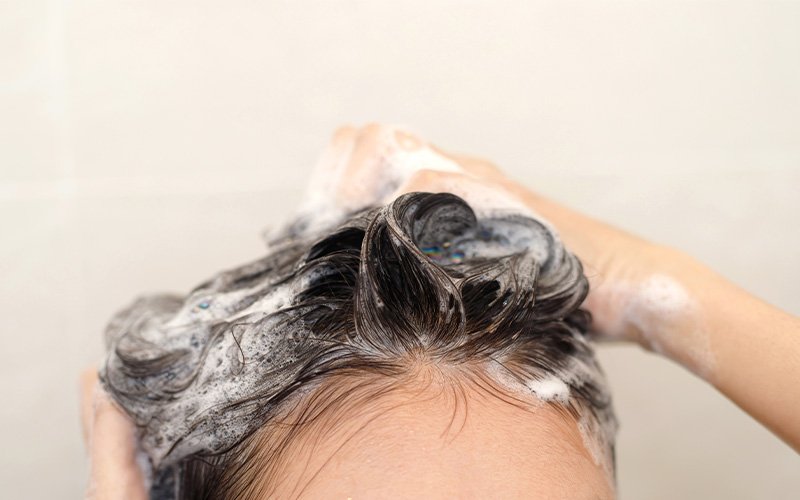 washing-dark-hair-with-shampoo-lather